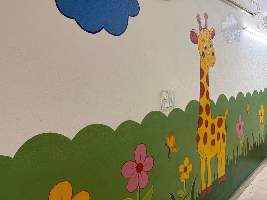 Giraffe mural in the Pre-Primary section corridor