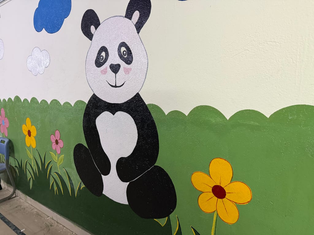 Panda mural in the Pre-Primary section corridor